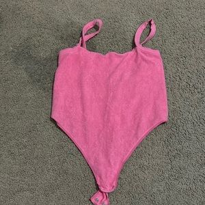 skims pink body suit